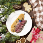 Christmas tree branch, empty plate and coffee